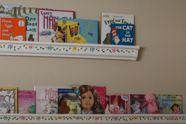 books in the shelving using the rain gutter ideas