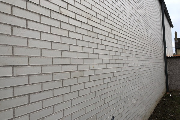 a beautiful brick-style concrete siding pattern