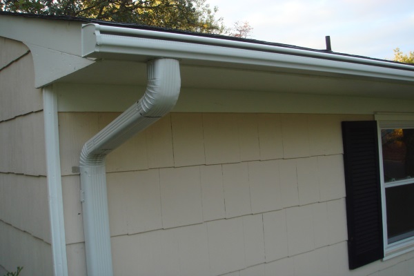 a downspout system attached to a residential gutter system