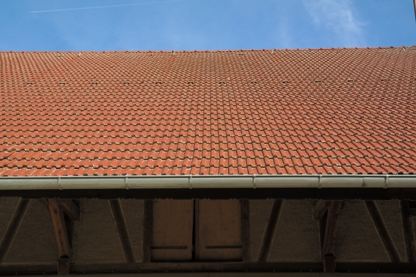 A clay tile roof's gutter system