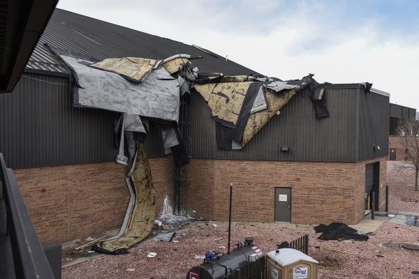 a gravely damaged metal roof