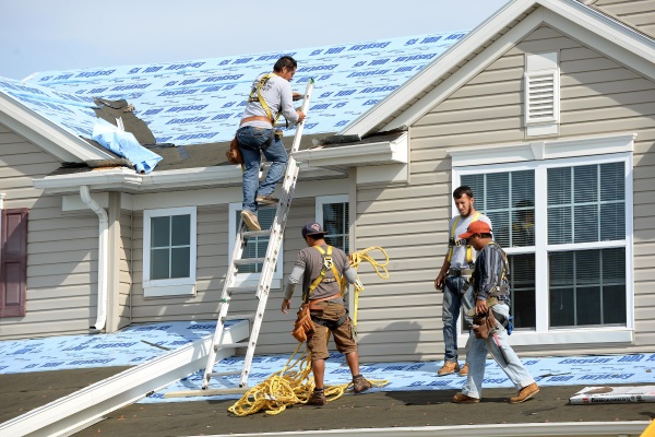 contractors repairing a residential property